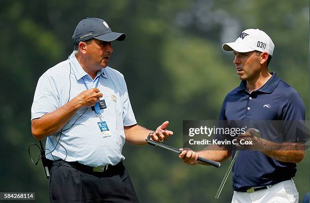 Charl Schwartzel of South Africa reacts after breaking an iron during the first round of the 2016 PGA Championship at Baltusrol Golf Club on July 28,...