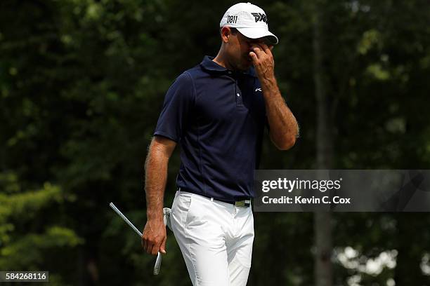 Charl Schwartzel of South Africa reacts after breaking an iron during the first round of the 2016 PGA Championship at Baltusrol Golf Club on July 28,...
