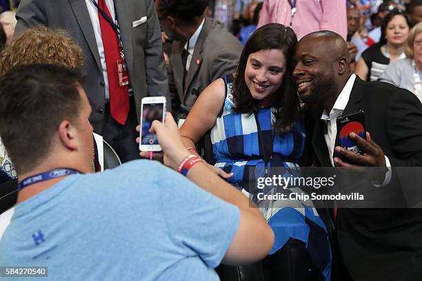 Anastasia Somoza, an international disability rights advocate, poses for a photo with delegates on the fourth day of the Democratic National...