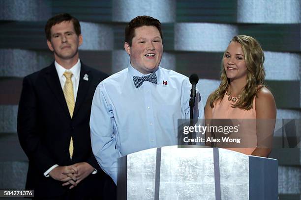 Jensen Walcott & Jake Reed deliver remarks as Dave Wills of Guilford County, NC looks onon the fourth day of the Democratic National Convention at...