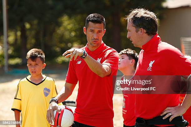 Former Liverpool players Luis Garcia and Robbie Fowler takes drills at a kids soccer clinic at the Addison-Penzak Jewish Community Center during the...