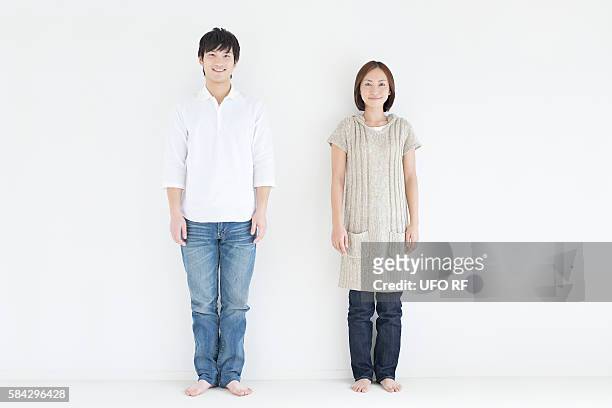 portrait of young couple - couple jeans shirt stock-fotos und bilder
