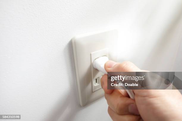 374 Pulling Out Plug Stock Photos, High-Res Pictures, and Images ...