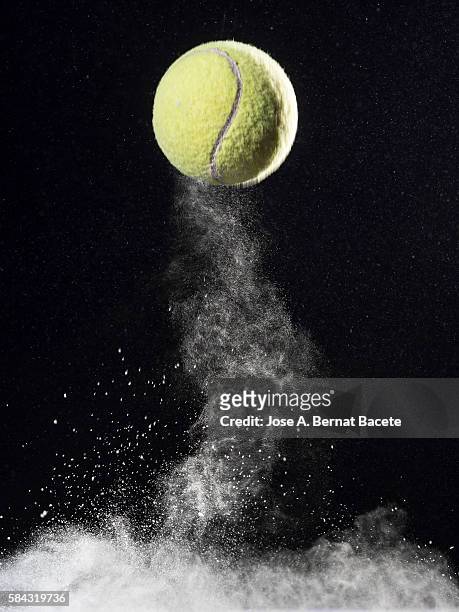 cloud of the impact of a ball of tennis on a surface with powder - tennis quick stock pictures, royalty-free photos & images