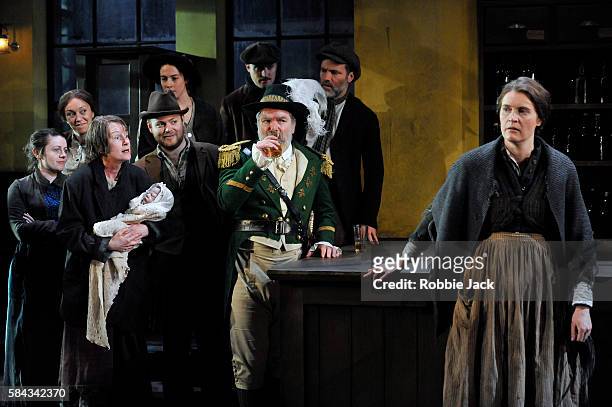 Josie Walker as Mrs Gogan, Lloyd Hutchinson as Peter Flynn and Justine Mitchell as Bessie Burgess with artists of the company in Seán O'Casey's The...