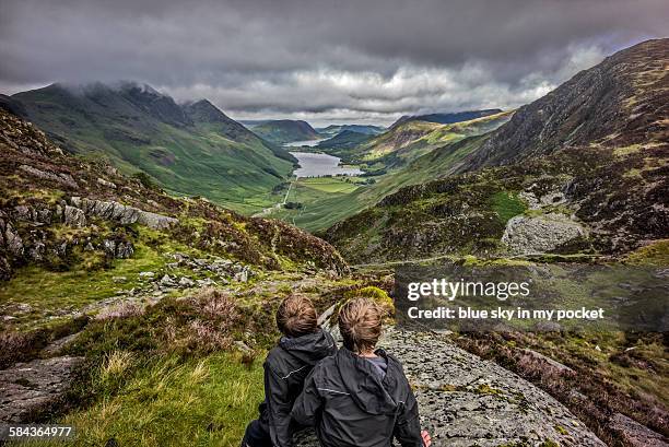 two boys looking down on buttermere - white hoodie back stock pictures, royalty-free photos & images