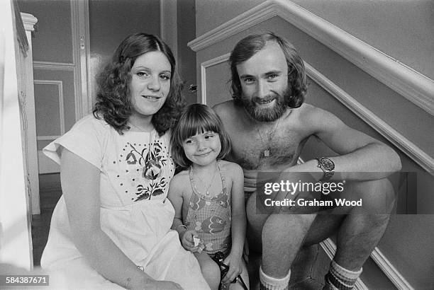 English singer-songwriter and drummer with rock group, Genesis, Phil Collins, with his first wife, Andrea Bertorelli, and her four year-old daughter,...