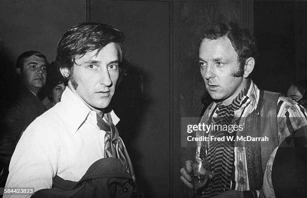 Portrait of American artist Edward Ruscha and British artist Gerald Laing as they attend an unspecifed event, New York, New York, October 11, 1967.