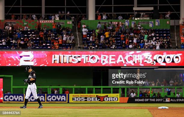 Ichiro Suzuki of the Miami Marlins walks on the field after hitting a double for his 2,998th MLB career hit during the seventh inning of the game...