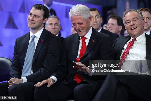 Former US President Bill Clinton laughs with US Vice President nominee Tim Kaine as Marc Mezvinsky looks on during the fourth day of the Democratic...