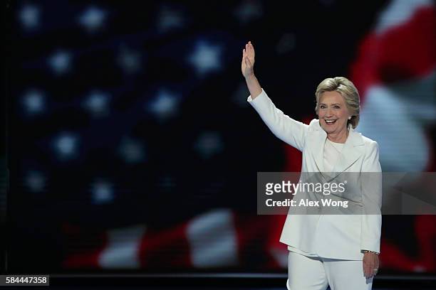 Democratic presidential nominee Hillary Clinton waves to the crowd as she arrives on stage during the fourth day of the Democratic National...