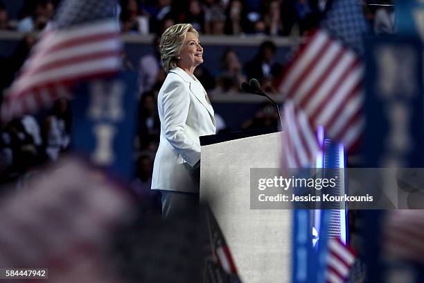 Democratic presidential nominee Hillary Clinton acknowledges the crowd as she arrives on stage during the fourth day of the Democratic National...