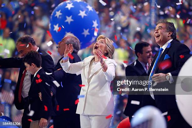 Democratic presidential candidate Hillary Clinton watches balloons drop at the end of the fourth day of the Democratic National Convention at the...