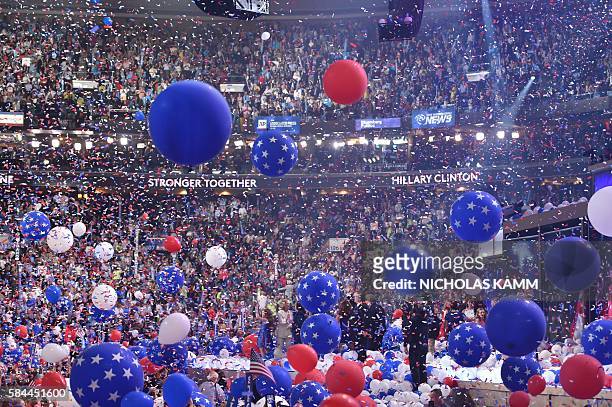 Balloons descend as Democratic presidential nominee Hillary Clinton celebrates on the fourth and final night of the Democratic National Convention at...