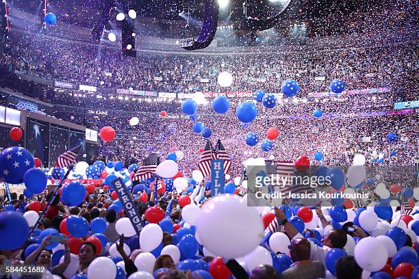 Balloons fall over delegates and attendees at the end of the fourth day of the Democratic National Convention at the Wells Fargo Center, July 28,...