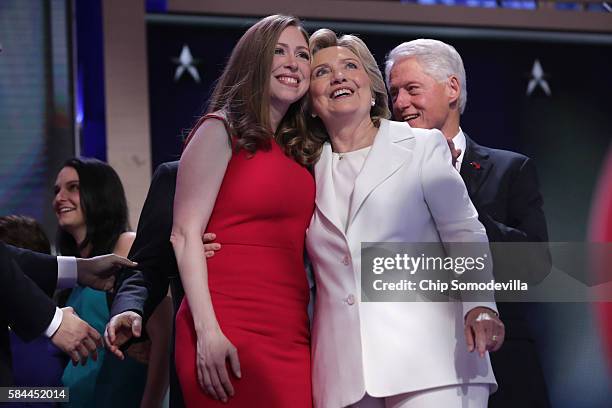 Democratic presidential candidate Hillary Clinton along with her daughter Chelsea Clinton acknowledge the crowd at the end on the fourth day of the...