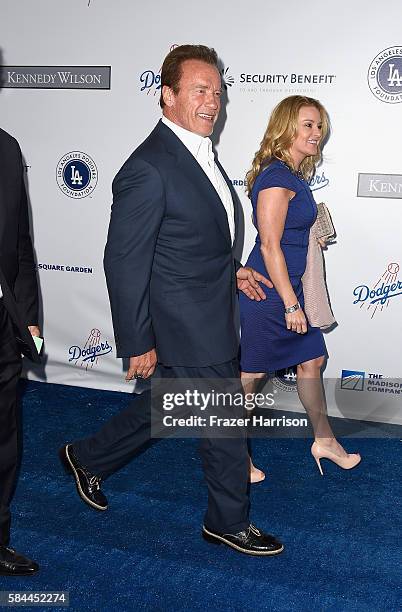 Arnold Schwarzenegger and Heather Milligan arrive at the Los Angeles Dodgers Foundation Blue Diamond Gala at Dodger Stadium on July 28, 2016 in Los...