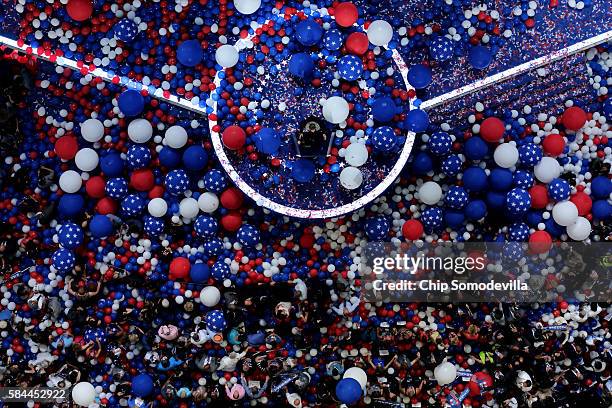 Reverend Bill Shillady closes with the benediction as attendees and delegates stand amongst balloons on the fourth day of the Democratic National...