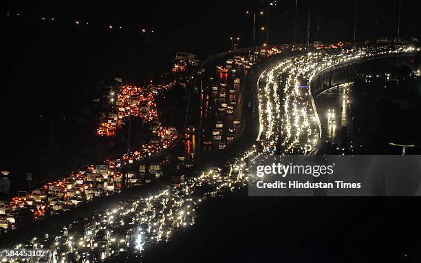 After the heavy rain, vehicles stuck in long traffic jam at Delhi-Gurgaon expressway on July 28, 2016 in Gurgaon, India. The Gurgaon Police issued an...