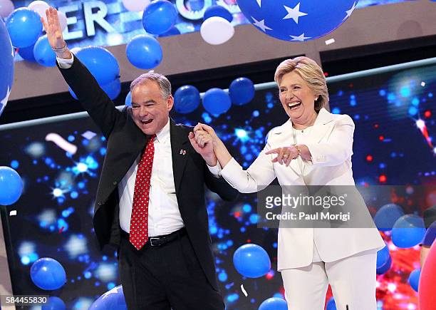 Democratic presidential candidate Hillary Clinton and U.S. Vice President nominee Tim Kaine acknowledge the crowd at the end on the fourth day of the...
