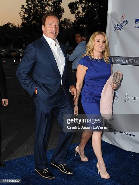 Arnold Schwarzenegger and Heather Milligan attend the Los Angeles Dodgers Foundation Blue Diamond gala at Dodger Stadium on July 28, 2016 in Los...
