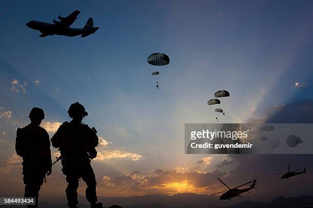 military mission at dusk - paratrooper stock pictures, royalty-free photos & images