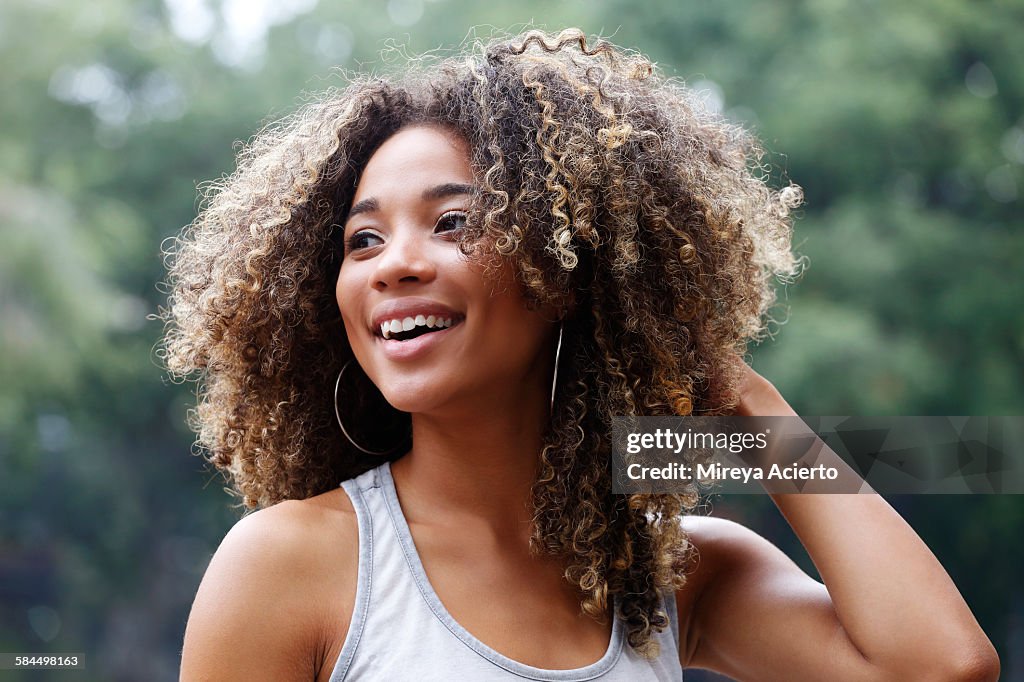 Young Latina woman laughing
