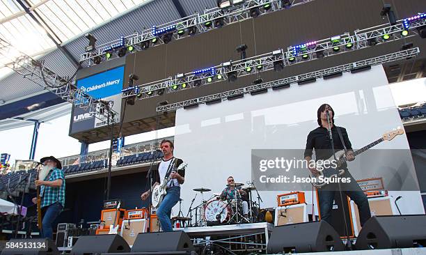 Musicians Jesse Hughes, Dave Catching, Matt McJunkins, Eden Galindo, and Jorma Vik of Eagles of Death Metal perform at Children's Mercy Park on July...