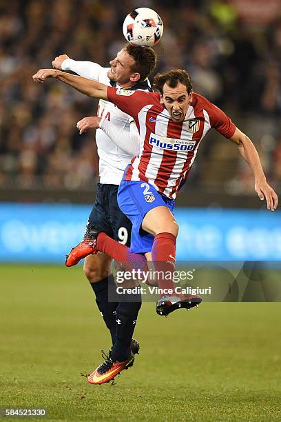 Vincent Janssen of Tottenham Hotspur headers the ball against Diego Godin of Atletico de Madrid during 2016 International Champions Cup Australia...