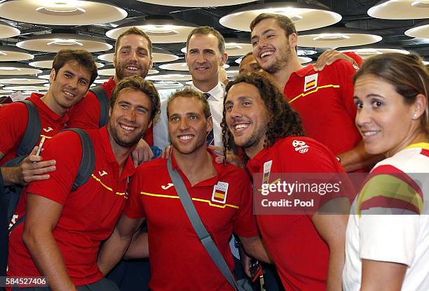 King Felipe VI Of Spain poses with Spanish Olympic Team participants during the Olympics Games "RIO 2016" farewell at Adolfo Suarez Airport on July...