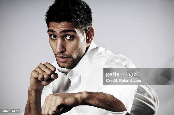 Professional boxer Amir Khan is photographed on December 23, 2011 in Bolton, England.