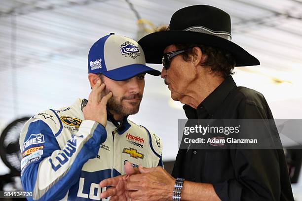 Jimmie Johnson, driver of the Lowe's Chevrolet, talks to NASCAR Hall of Fame driver Richard Petty during practice for the NASCAR Sprint Cup Series...