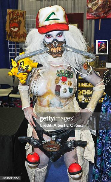 Artist Rannie Rodil in a mashup of Pokemon and 'Mad Max: Fury Road' on day 1 of Comic-Con International 2016 at San Diego Convention Center on July...