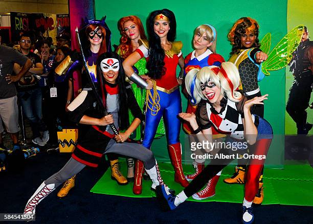 Cosplayers dressed as Batgirl, Poison Ivy, Wonder Woman, Katana and Harley Quinn at the DC booth on day 1 of Comic-Con International 2016 at San...