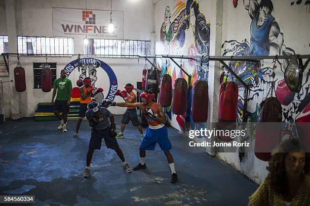 Summer Games Preview: View of boxing students in action during photo shoot at Academia Todos na Luta in Favela do Vidigal. Rio de Janeiro, Brazil...