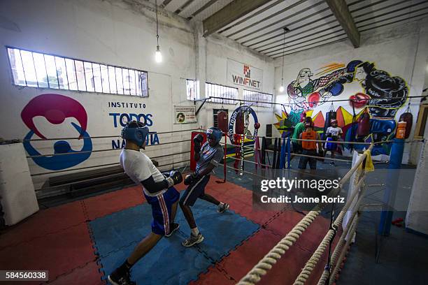 Summer Games Preview: View of boxing students in action during photo shoot at Academia Todos na Luta in Favela do Vidigal. Rio de Janeiro, Brazil...