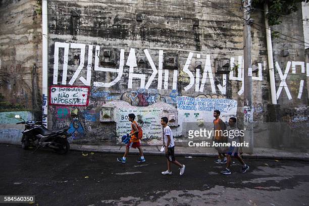 Summer Games Preview: View of boxing students from Academia Todos na Luta walking outside during photo shoot in Favela do Vidigal. Rio de Janeiro,...