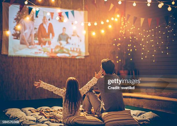 father and daughter day. - outside cinema stockfoto's en -beelden