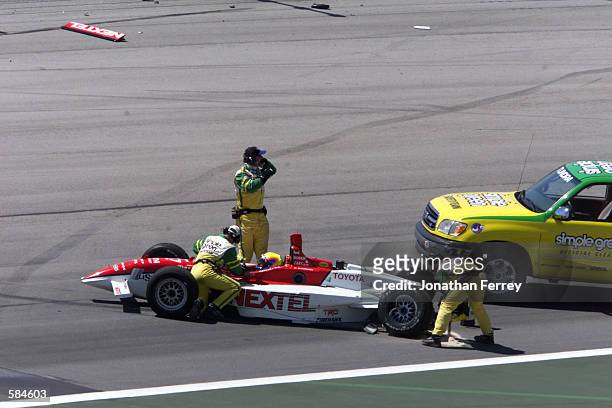 Mauricio Gugelmin is carefully extracated from his car by the Simple Green Safety Crew after his accident during practice for the Target Grand Prix,...