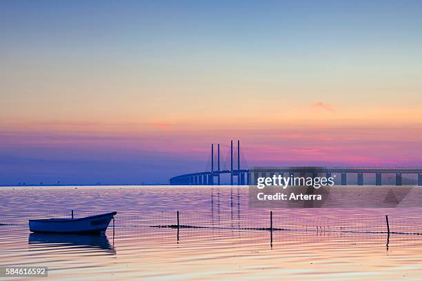 Oeresund / Ì÷resund Bridge, double-track railway and dual carriageway bridge-tunnel between Denmark and Sweden at sunset, Scandinavia.