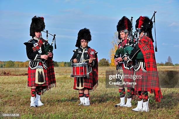 Scottish bagpipers playing pipes and drums, Scotland, UK.