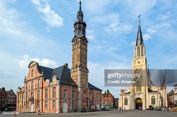 Town hall with belfry and Church of Our Lady / Onze-Lieve-Vrouwekerk at the Main Square / Grand Place of Sint-Truiden, Limburg, Belgium.