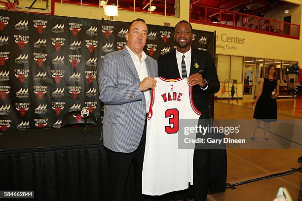 Dwyane Wade of the Chicago Bulls is introduced by Chicago Bulls general manager Gar Forman at a press conference on July 29, 2016 at the Advocate...