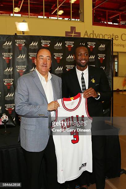 Dwyane Wade of the Chicago Bulls is introduced by Chicago Bulls general manager Gar Forman at a press conference on July 29, 2016 at the Advocate...