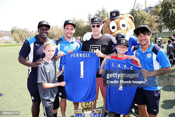 Leicester City's Shinji Okazaki, Christian Fuchs, club ambassador and LAFC co-owner Will Ferrell during a community session for locals during their...