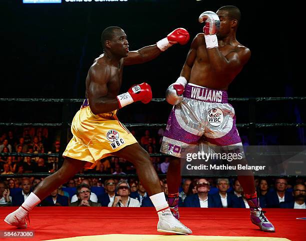 Adonis Stevenson of Canada punches Thomas Williams Jr. Of the US. During their WBC light heavyweight championship fight at the Centre Videotron on...