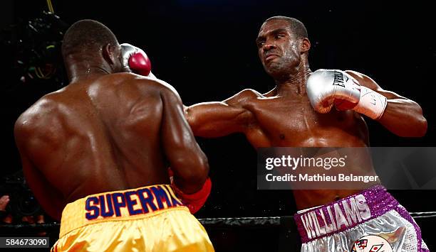 Thomas Williams Jr. Of the US. Punches Adonis Stevenson of Canadaduring their WBC light heavyweight championship fight at the Centre Videotron on...