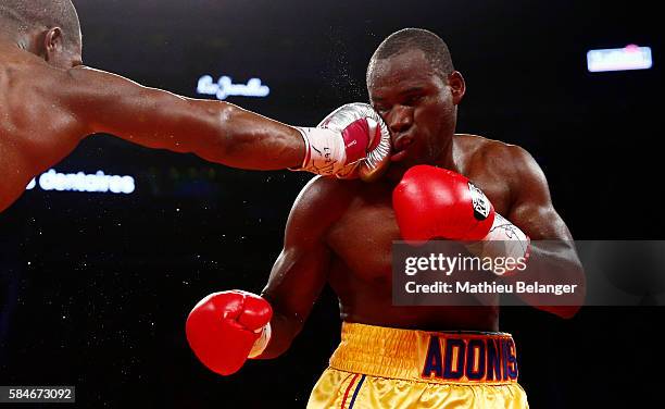 Thomas Williams Jr. Of the US. Punches Adonis Stevenson of Canadaduring their WBC light heavyweight championship fight at the Centre Videotron on...