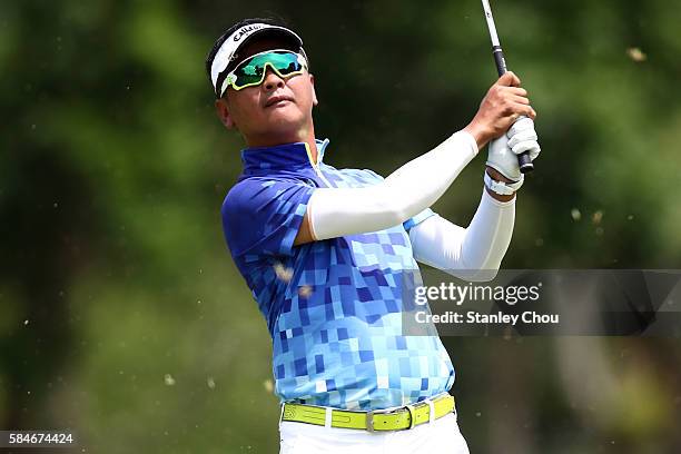 Lin Wen-tang of Chinese Taipei plays his 2nd shot on the 1st hole during round three of the King's Cup at Phoenix Gold Golf and Country Club on July...