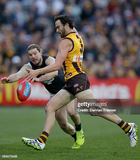 Jordan Lewis of the Hawks kicks a goal during the round 19 AFL match between the Hawthorn Hawks and the Carlton Blues at Aurora Stadium on July 30,...
